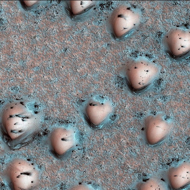 Sand dunes natural consequence of the wind patterns on Mars Dark spots are due to seasonal frost that has sublimed away CreditNASA JPL
