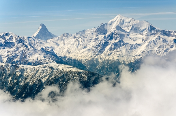 The Matterhorn and Weisshorn rising above the clouds - Valais Switzerland 