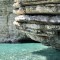 Eroded rocks and beautiful blue water of Corfu Greece 