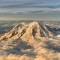 Typically Im annoyed of flights getting delayed on this occasion not so as  mins of delay caused my flight to flew by Mount Rainier Washington around golden hour