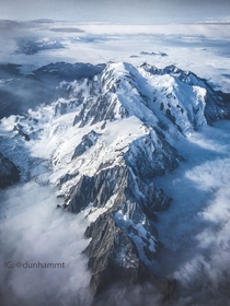  Degrees East  Degrees North - An aerial view of the Mont Blanc massif jutting above the clouds 