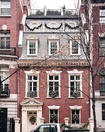  Georgian Revival townhouse with a mansard roof in Upper East Side Manhattan New York City
