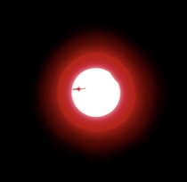  Solar Eclipse my birthday I captured a plane flying in front of the eclipse This is a still from a video I took Was the beginning of the eclipse The world was sold out of lenses so I made a makeshift lens out of a floppy disk First time ever filming the 