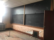  year old high school with slide down chalk boards