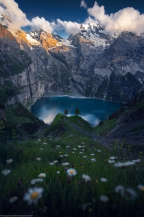 A beautiful alpine lake in the Swiss Alps  by marcograssiphotography