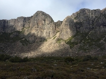 A brief break in the clouds over Dolerite rock formations Walls of Jerusalem National Park Tasmania Australia 
