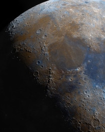 A close-up shot of the surface of the Moon in color 