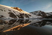 A Colorado sunrise over an alpine mirror 