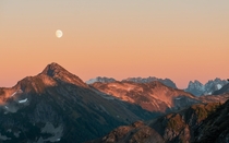 A colorful moonrise over the North Cascades WA USA 