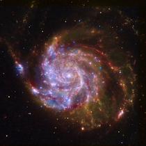 A composite view of the spiral galaxy Messier  from Spitzer Hubble and Chandra 