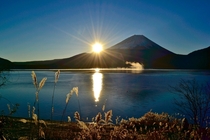 A crisp sunrise on Mt Fuji from Lake Motosu Japan 
