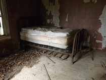 A dingy bed left behind in an abandoned house in Gudger Tennessee The landowner told us the home was used as a living quarters for farmhands working on his fathers farm