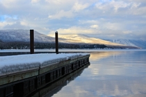 A dock on Lake McDonald Glacier National Park Montana abandoned for the winter 