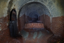 A drain tunnel underneath a park