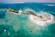 A dredging ship which is creating the Palm Islands Dubai  