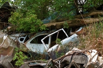 A few of the many junk cars used to fortify the banks of the Iowa river I took this particular photo in summer of  in Hills IA but there are many locations along the river like this to this day