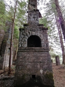 A fireplace from an abandoned house at an old coal mine on Vancouver Island BC Canada