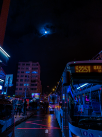 A humble bus beneath a nearly full moon in Mecidiyeky