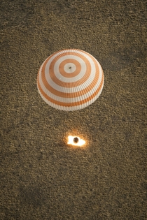 A landing on planet Earth for Expedition  from the ISS with parachute deployed and retro-rockets blazing three days ago 