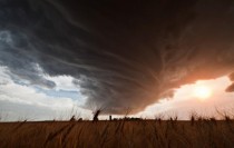 A massive storm cloud twists above wheat fields in western Nebraska 