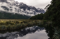 A misty morning on the Mirror Lakes in New Zealand 