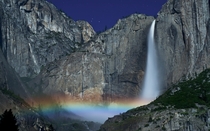 A moonbow or lunar rainbow is cast by the Yosemite Falls California 
