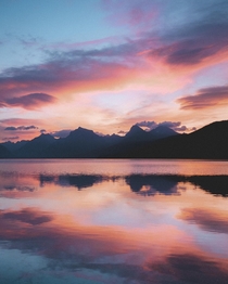 A near-perfect reflection during the best sunrise Ive ever seen at Lake McDonald in Glacier National Park Montana 