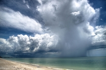 A photo I took of an isolated rain shower about  miles north of Naples Florida Greg Travers 