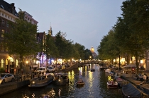 A photo to make you miss summer an evening on the canals of Amsterdam 