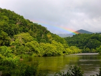 A rare rainbow shines through the stormy smoke in the aptly named Great Smoky Mountains National Park 