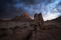 A rare stormy sunrise from this beautiful rocky somewhat barren place in the Namibian desert - Spitzkoppe 