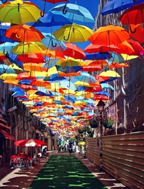 A roof of umbrellas over a courtyard in gueda Portugal 