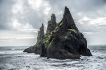 A sea stack off the coast of Iceland  Photographed by Romain Ribaud