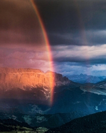 A spectacular burst of light before the storm arrived over the Dolomites Italy 