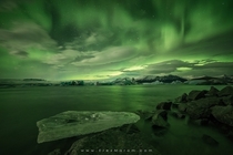 A spectacular night of Northern Lights above Icelands famous glacier lagoon Jkulsrln  Photo by Erez Marom xpost from rsland