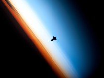 A stunning silhouette of the Space Shuttle Endeavour over Earths horizon Photo shot from the ISS 