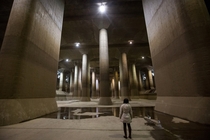 A tourist views the enormous pressure-adjusting underground water tank during a tour of the Metropolitan Area Outer Underground Discharge Channel facility in Tokyo Japan Chris McGrath 