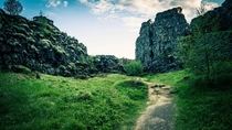 A trail running through the continental divide at ingvellir Iceland 