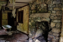 A tub and stone fireplace at a mountain hotel once used by Theodore Roosevelt OC x