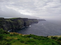 A typical grey Irish day at the Cliffs of Moher County Clare Ireland This is the view about  kilometres about  miles hike north of the visitors centre We spent an hour here completely alone just taking in every detail 