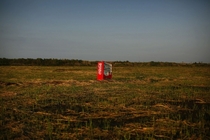 A vending machine brought inland by the tsunami in an abandoned rice field in Fukushima 