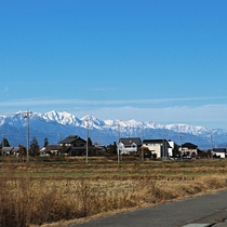 A village with the Japanese Alps in the background Nagano Prefecture Japan 