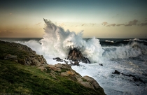 A wave crashes against the rocks  Photographed by Alfonso Maseda Varela