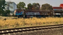 Abandoned and heavily graffitied RG Rail Grinder locomotives left in a railway siding Victoria Australia