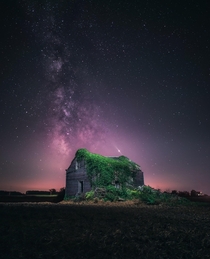 Abandoned building over the night sky