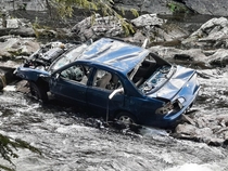Abandoned car in river Vermont