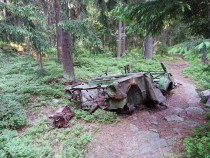 Abandoned decayed car in woods of Helsinki Finland 