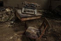 Abandoned desk and typewriter 