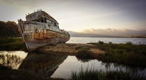 Abandoned fishing boat on a sanbar in Tomales Bay California 