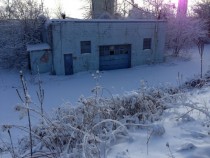 Abandoned Garage Hidden Behind Snow 